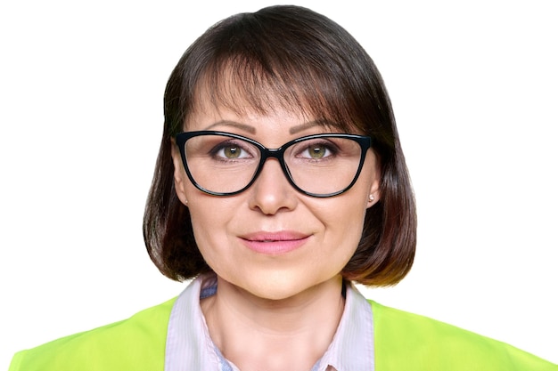 Headshot of industrial mature woman in protective vest glasses on white isolated background