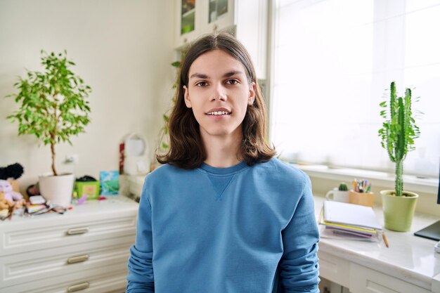 Headshot portrait teenage male student talking looking at camera