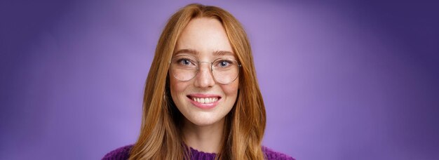 Photo headshot of smart goodlooking joyful and friendly redhead s female in transparent glasses smiling br