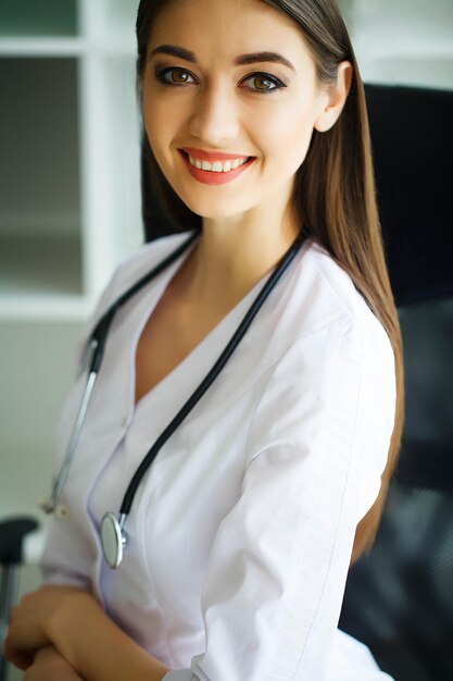 Health and Beauty Portrait of a Happy Dietitian in the Light Room