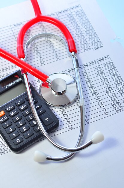 Health care costs. Stethoscope and calculator symbol for health care costs or medical insurance