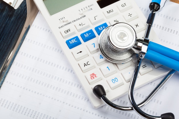 Health care costs. Stethoscope and calculator 