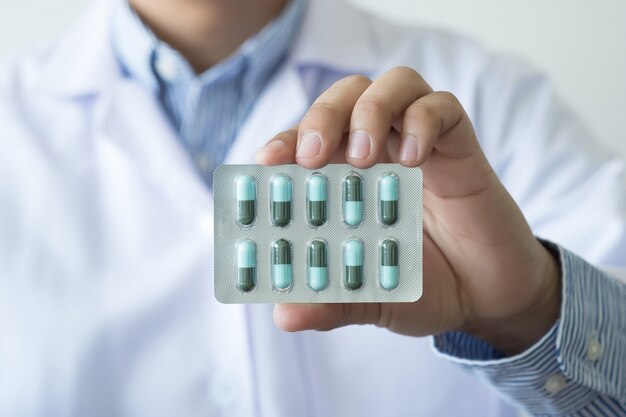 health care  female pharmacist hold medicine bottle pharmacist holding at drugstore