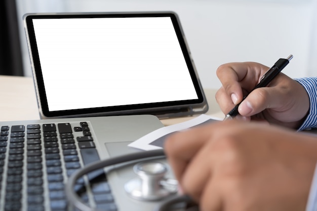 Health care writing prescription Doctor working with laptop computer