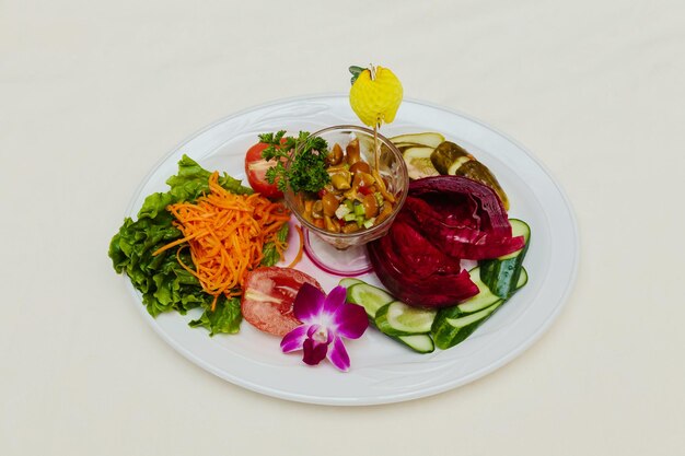 Health dinner atlantic light roast fish sea tuna served on plate with vegetables and lemon isolated on white background