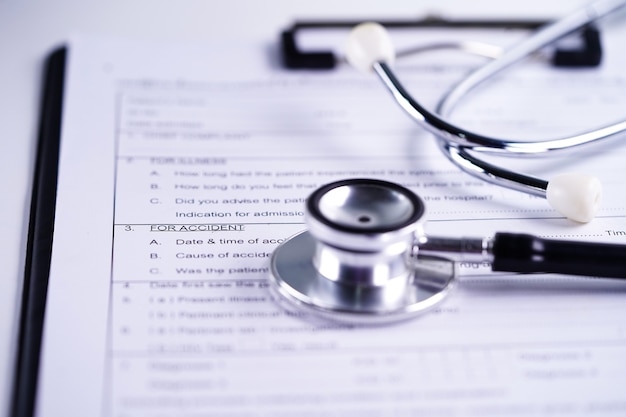 Health insurance accident claim form with stethoscope