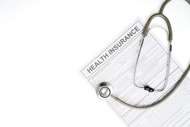 Health insurance application form and stethoscope