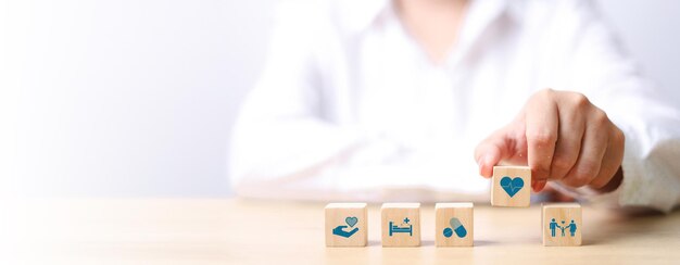Photo health insurance concept healthcare medical wooden cube block with icon health and welfare health
