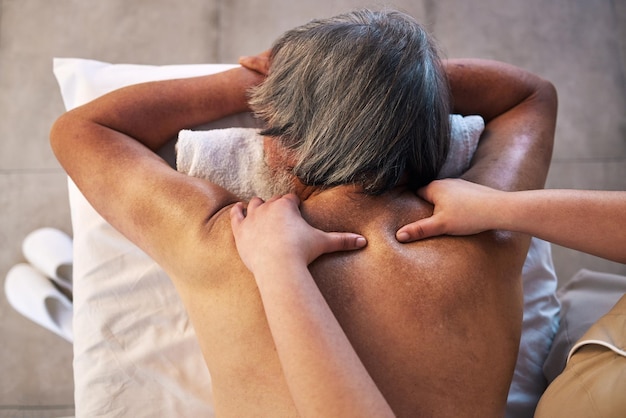 Health massage and back of man in spa for wellness holistic treatment and hospitality Peace cosmetics and salon with body of customer and masseuse for relax vacation and physical therapy