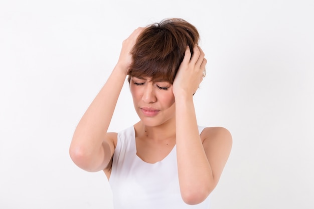 Health and pain. Stressed exhausted young woman having strong tension headache.  Isolated on white b