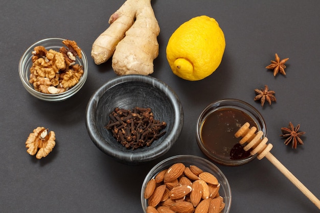 Health remedy foods for cold and flu relief with lemon ginger honey and walnuts