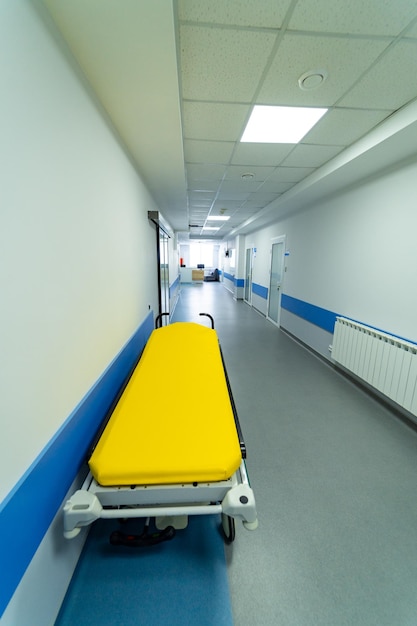 Healthcare clinical bed standing in corridor Medical modern inerior of corridor in hospital