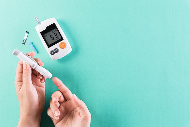 Healthcare and medical concept, The diabetic measures the level of glucose in the blood