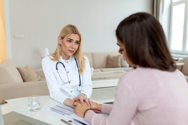 Healthcare and medical concept doctor with patient in hospital Doctor working in the office and listening to the patient she is explaining her symptoms healtcare and assistance concept