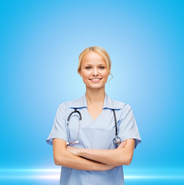 healthcare and medical concept - female doctor or nurse in medical mask holding syringe with injection