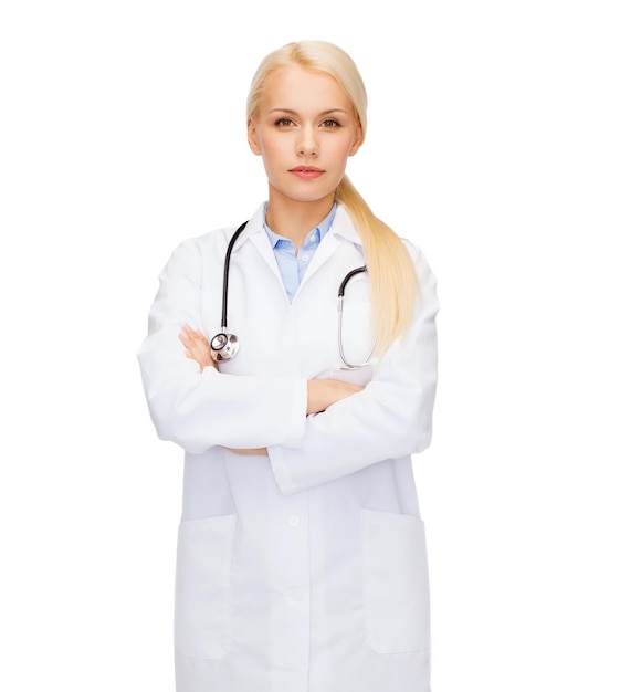 healthcare and medicine concept - serious female doctor with stethoscope