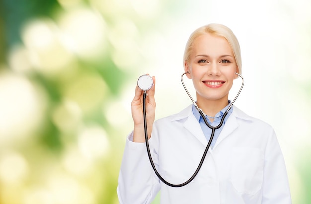 healthcare and medicine concept - smiling female doctor with stethoscope