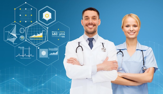 healthcare, people, cardiology and medicine concept - smiling doctors with stethoscopes over blue background and virtual charts