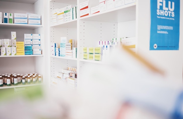 Healthcare pharmacy or shelf with medicine pills or supplements products at drugstore clinic Pharmaceuticals background blurry or boxes of medical products supplements stock or retail medication