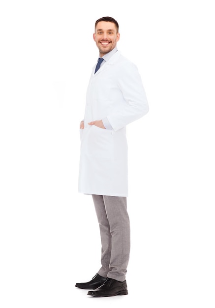 healthcare, profession and medicine concept - smiling male doctor in white coat over white background