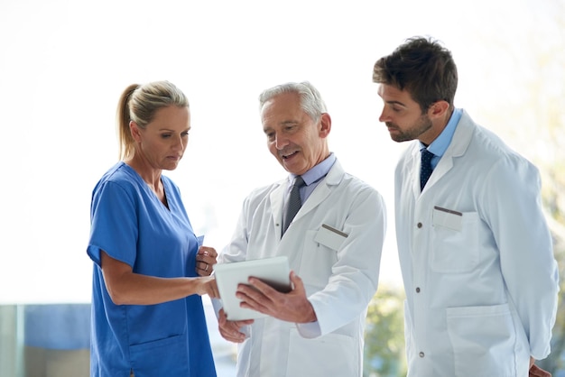 healthcare teamwork and medical people with tablet for diagnosis research treatment and planning together hospital nurse and doctors with digital for telehealth ideas and mentor for guidance