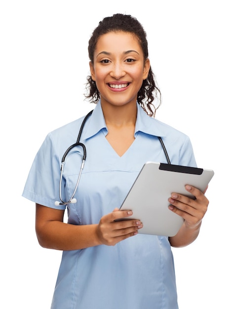 healthcare, technology and medicine concept - smiling female african american doctor or nurse with stethoscope and tablet pc computer