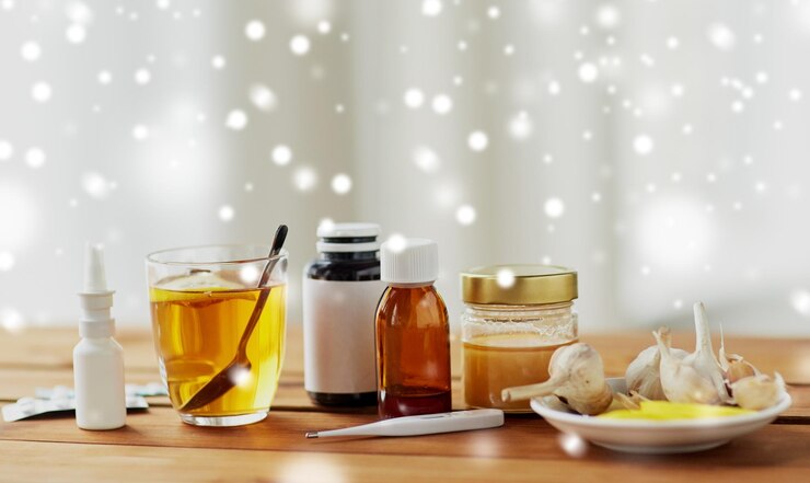 Photo healthcare traditional medicine flu and ethnoscience concept drugs on wooden table over snow
