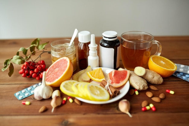 Photo healthcare, traditional medicine, flu and ethnoscience concept - drugs on wooden table