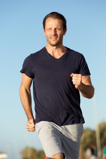 Healthy active man running outside