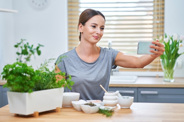 healthy adult woman making natural cosmetics at home