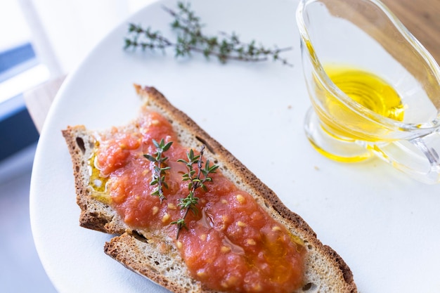 Healthy Andalucian breakfast, bread with olive oil and tomato and coffee