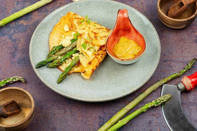 Healthy asparagus omelet on the plate