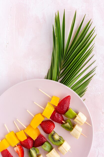 Healthy assorted fruit skewers from above