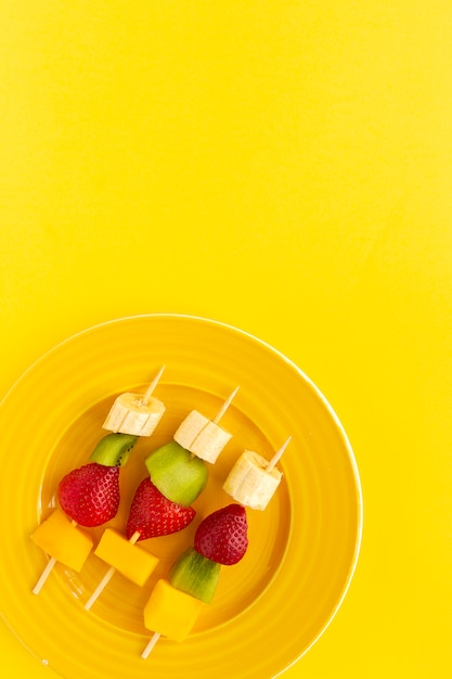 Healthy assorted fruit skewers from above