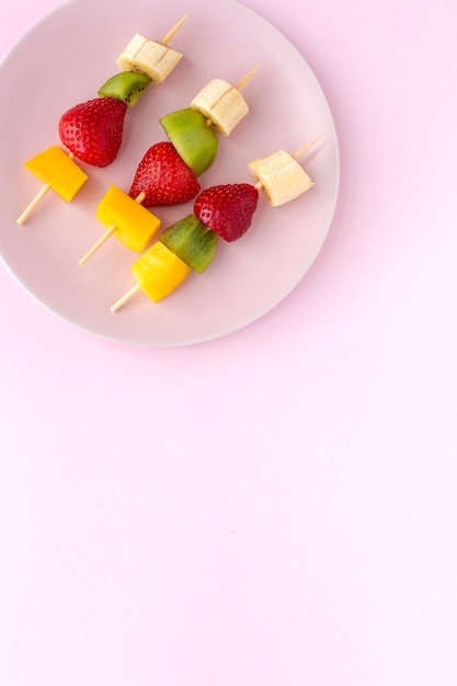 Healthy assorted fruit skewers from above