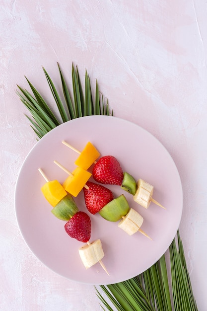 Healthy assorted fruit skewers from above