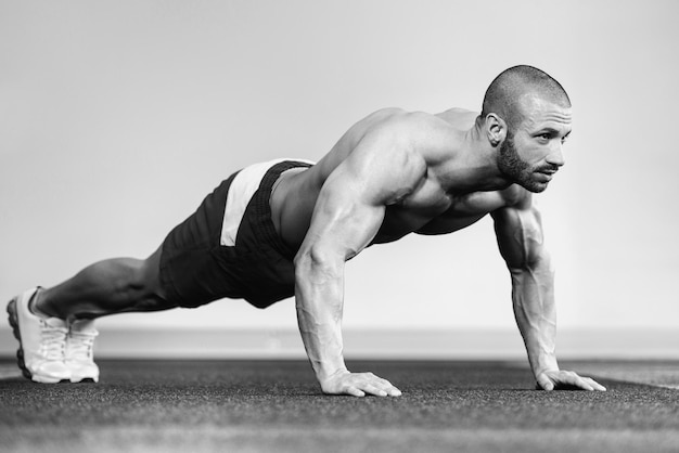 Healthy Athlete Doing Push Ups As Part Of Bodybuilding Training