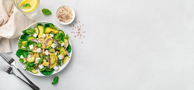 Photo healthy avacodo salad with feta herbs cucumber and nuts top view copy space