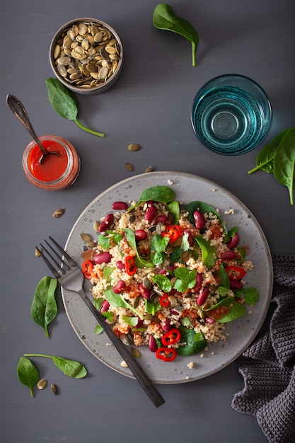 Healthy bean and quinoa salad with spinach, chili