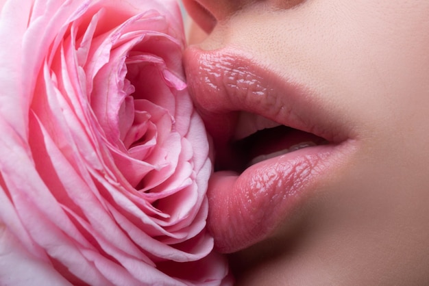 Healthy beautiful young woman with pink lips beautiful woman lips with rose