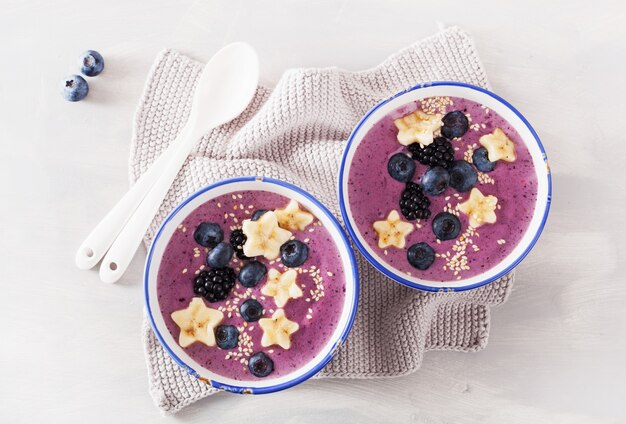 Healthy berry smoothie bowl with banana and sesame seed