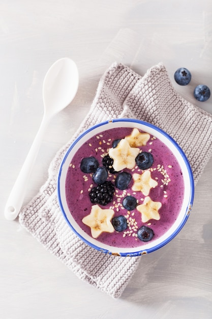 Healthy berry smoothie bowl with banana and sesame seed