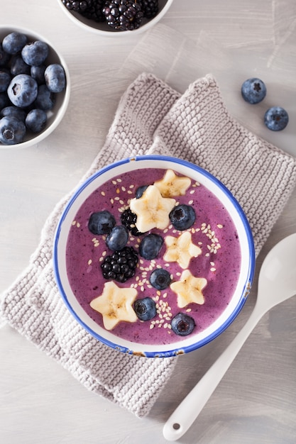 Healthy berry smoothie bowl with banana and sesame seed