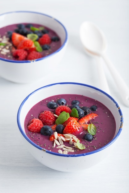 Healthy berry smoothie bowl with strawberry blueberry raspberry and chia seed