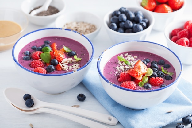 Healthy berry smoothie bowl with strawberry blueberry raspberry and chia seed