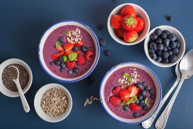 Healthy berry smoothie bowl with strawberry blueberry raspberry and chia seed