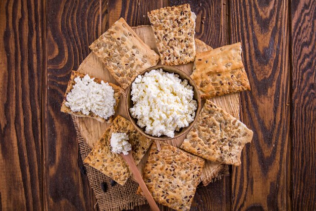 Healthy biscuits with grains and seeds on wooden table