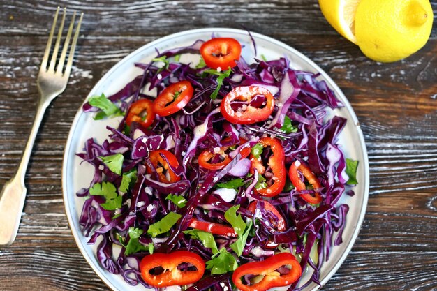 Healthy blue cabbage salad on a plate Vegan food Diet