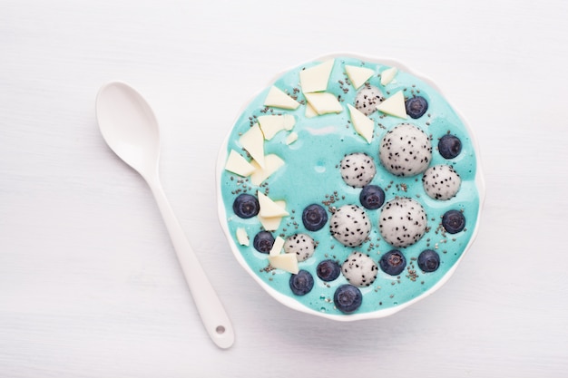 Healthy blue spirulina smoothie bowl with fruits