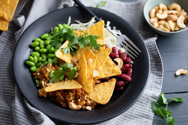 Healthy bowl with vegetables and chips